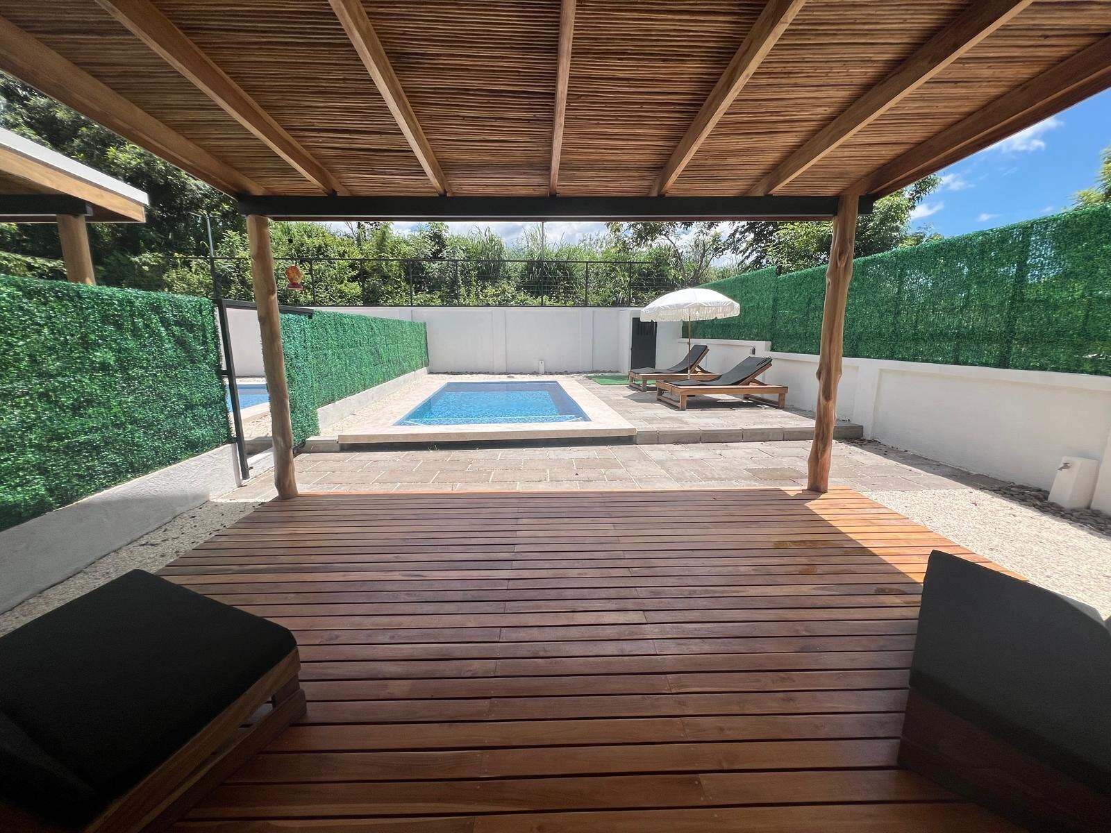 Wood deck, pergola and private pool at Cacique Retreat, Playas del Coco